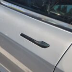 Tesla under investigation for door handles that trap people inside